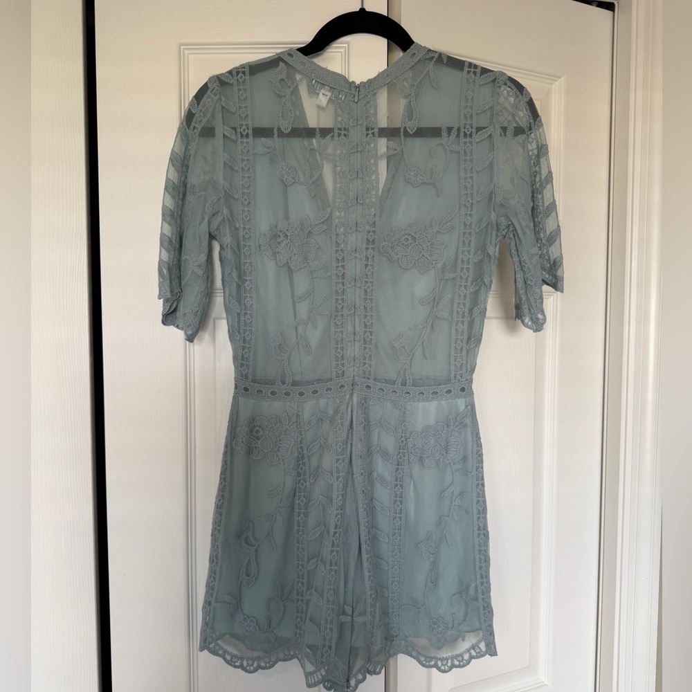 Lacy romper size S. Like new condition